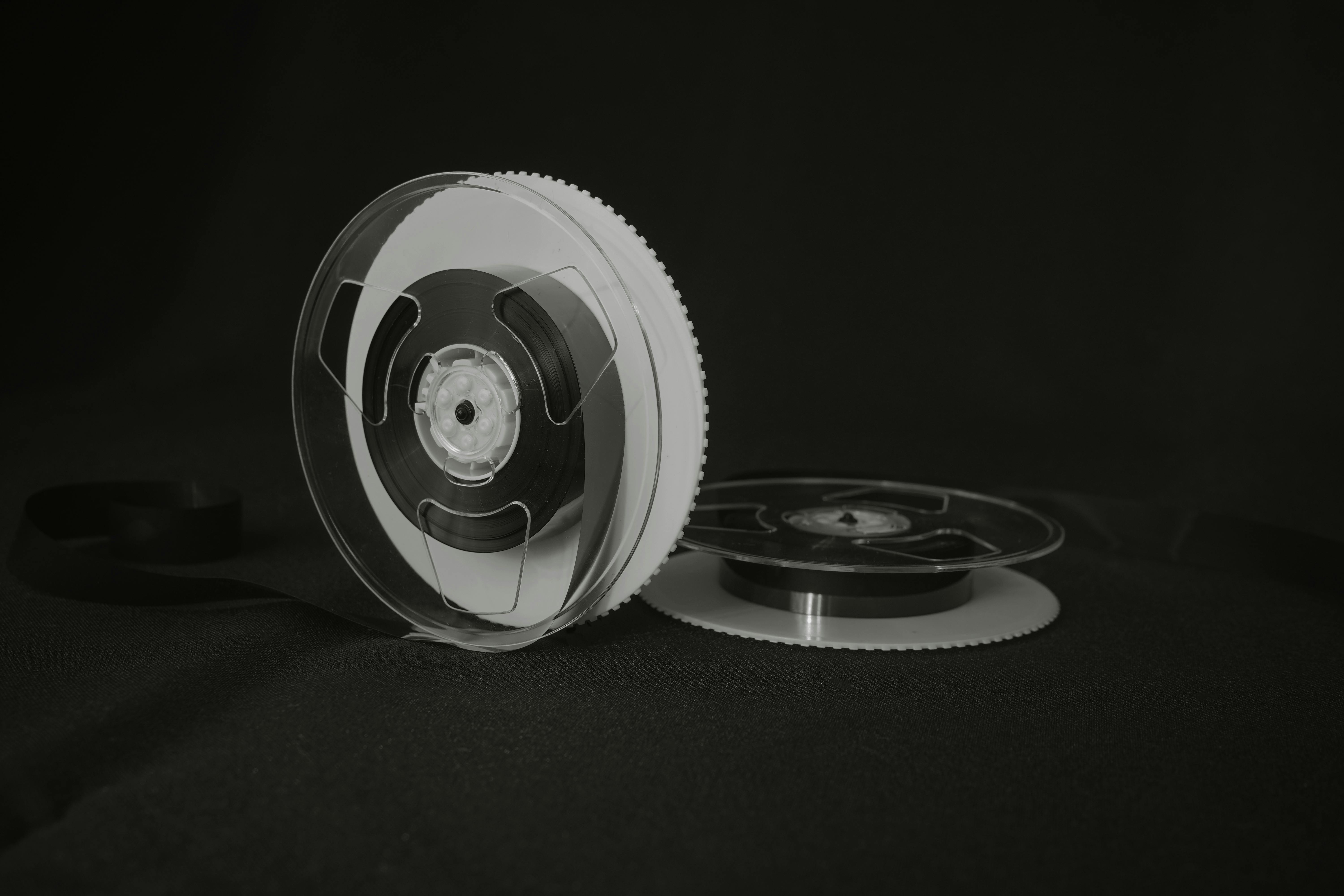 Guitar resting beside a keyboard in a bright studio